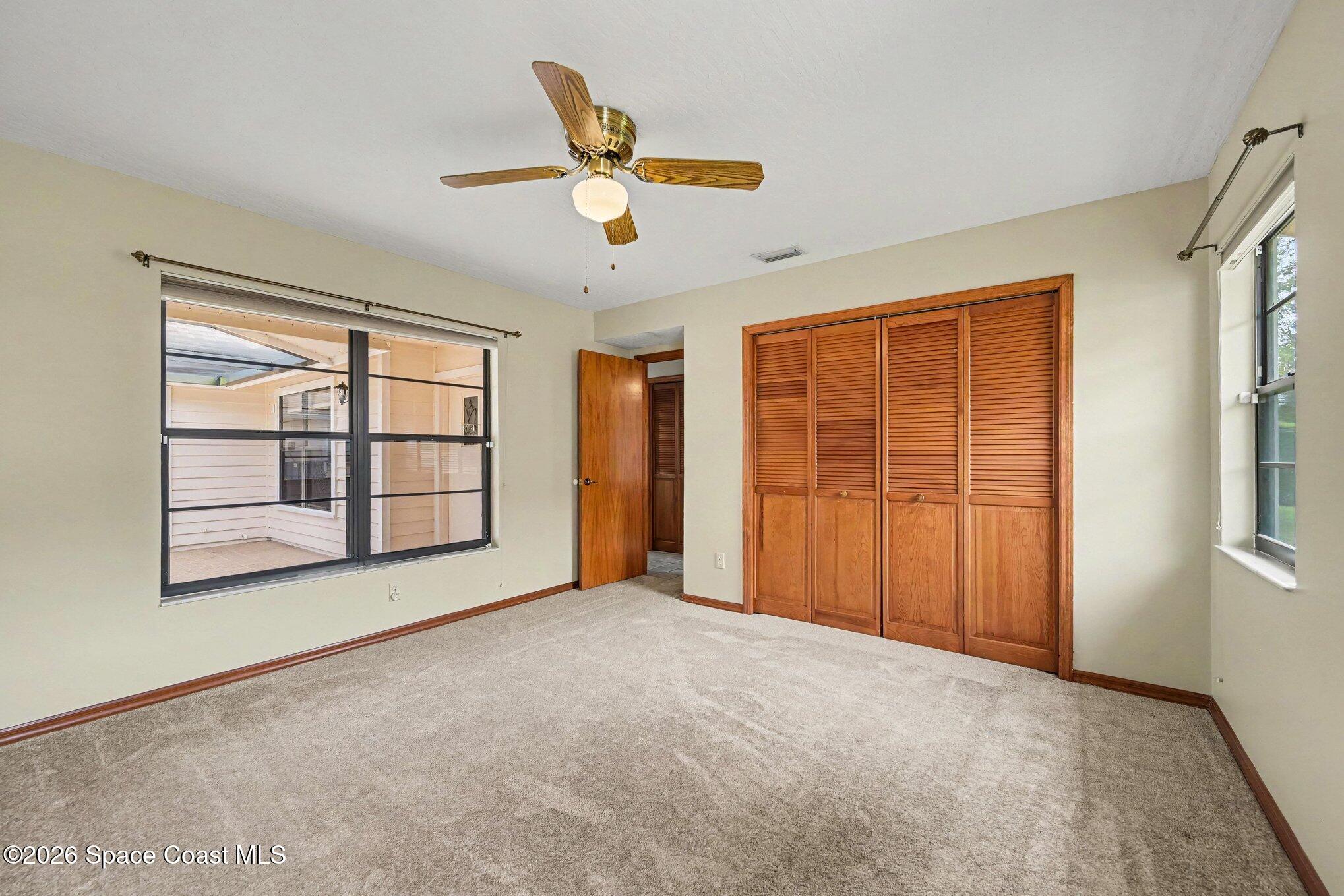 899 Ridge Lake Drive Melbourne, FL 32940 - Photo 20 of 34 a view of an empty room with a window