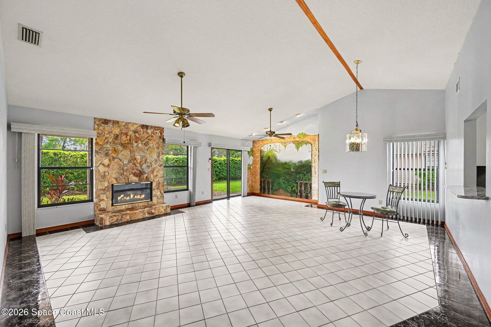 899 Ridge Lake Drive Melbourne, FL 32940 - Photo 5 of 34 a view of a livingroom with furniture window and outside view