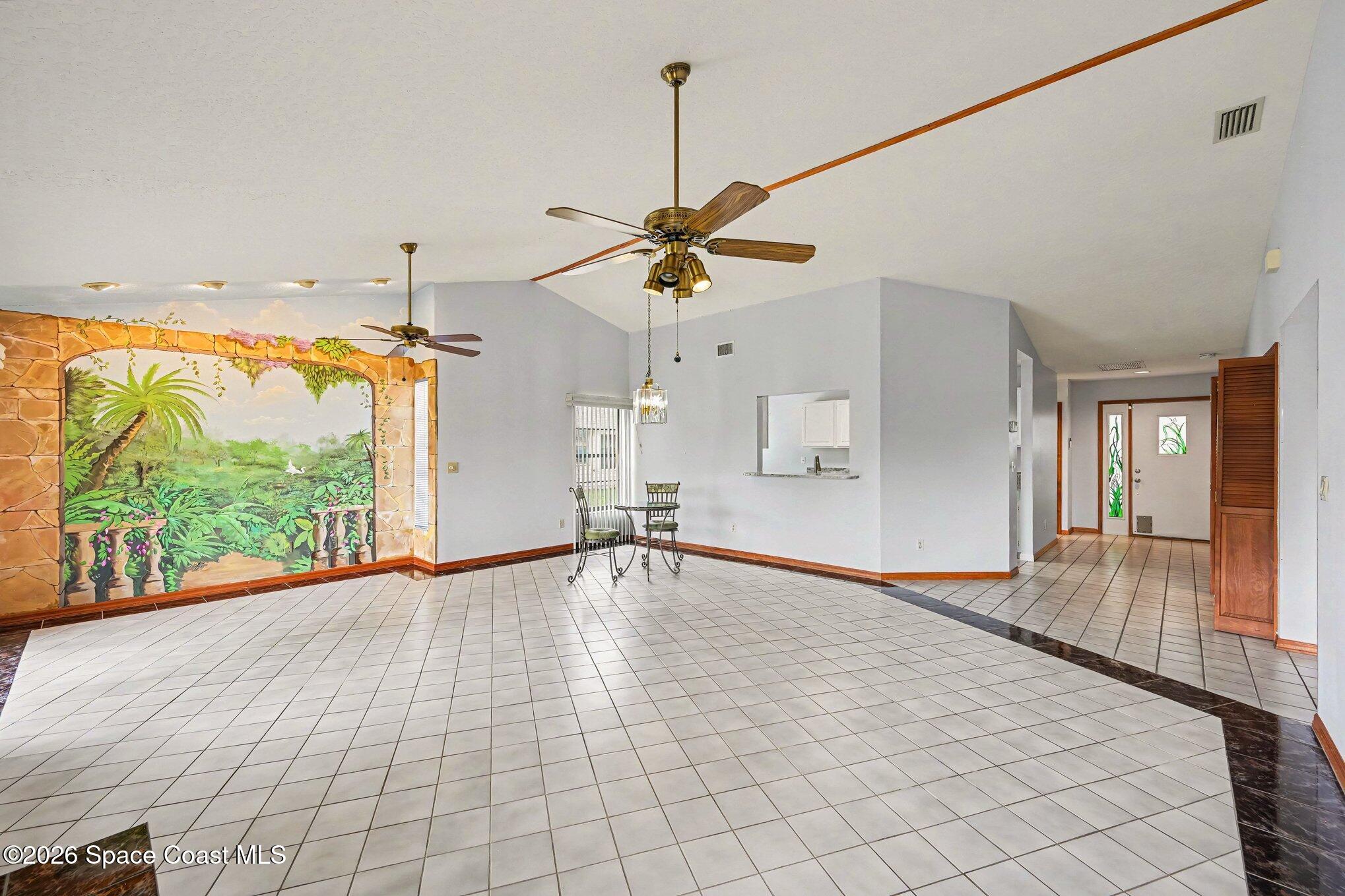 899 Ridge Lake Drive Melbourne, FL 32940 - Photo 6 of 34 a view of an empty room with a window
