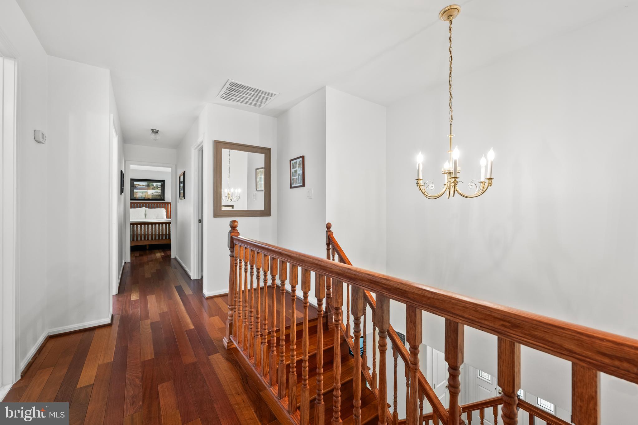 7362 Clifton Road Clifton, VA 20124 - Photo 16 of 53 a view of a hallway with wooden floor and stairs