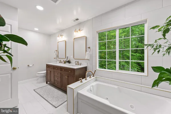 a bathroom with a bathtub and a sink
