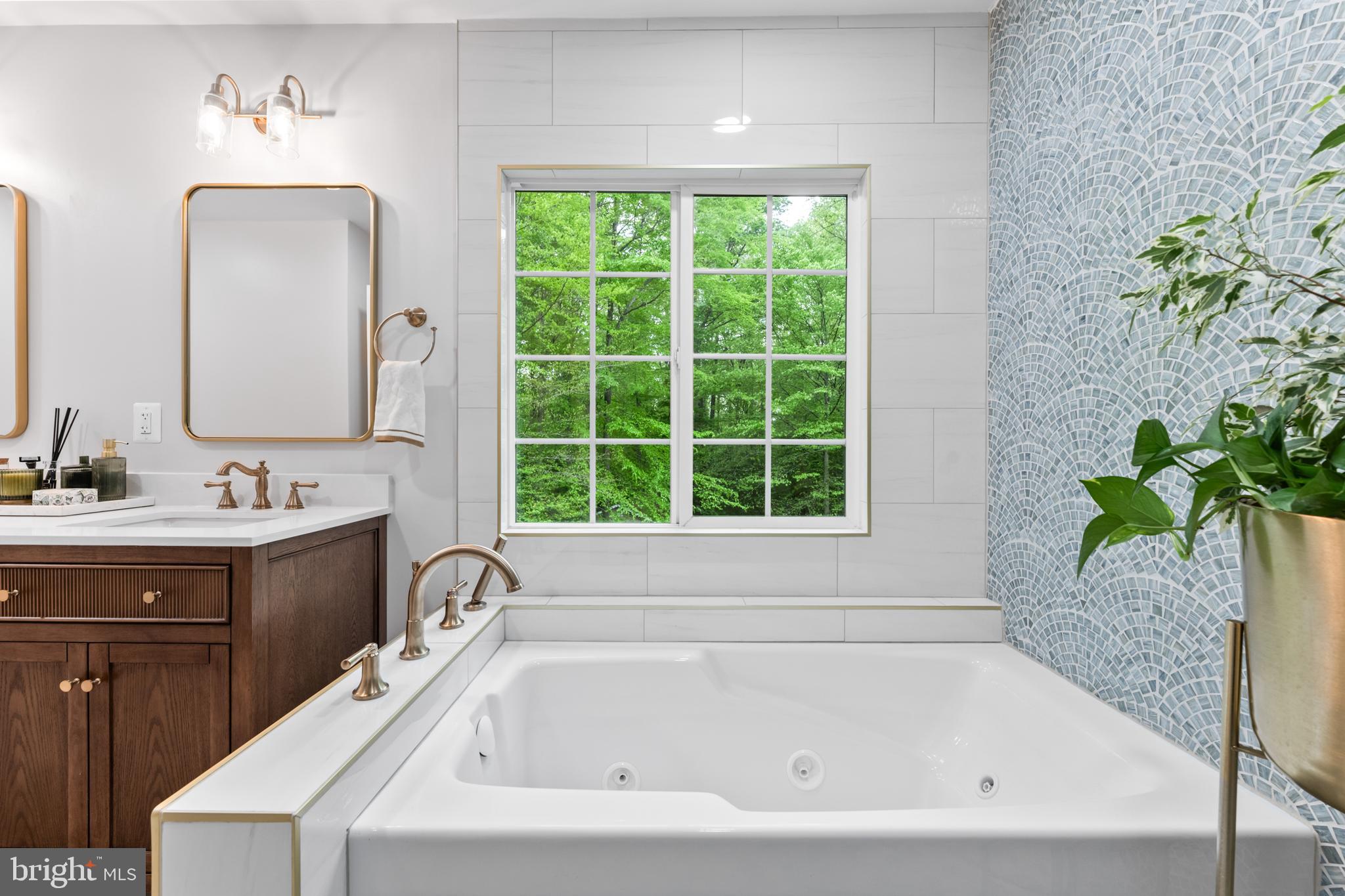 7362 Clifton Road Clifton, VA 20124 - Photo 22 of 53 a bathroom with a bathtub and a sink