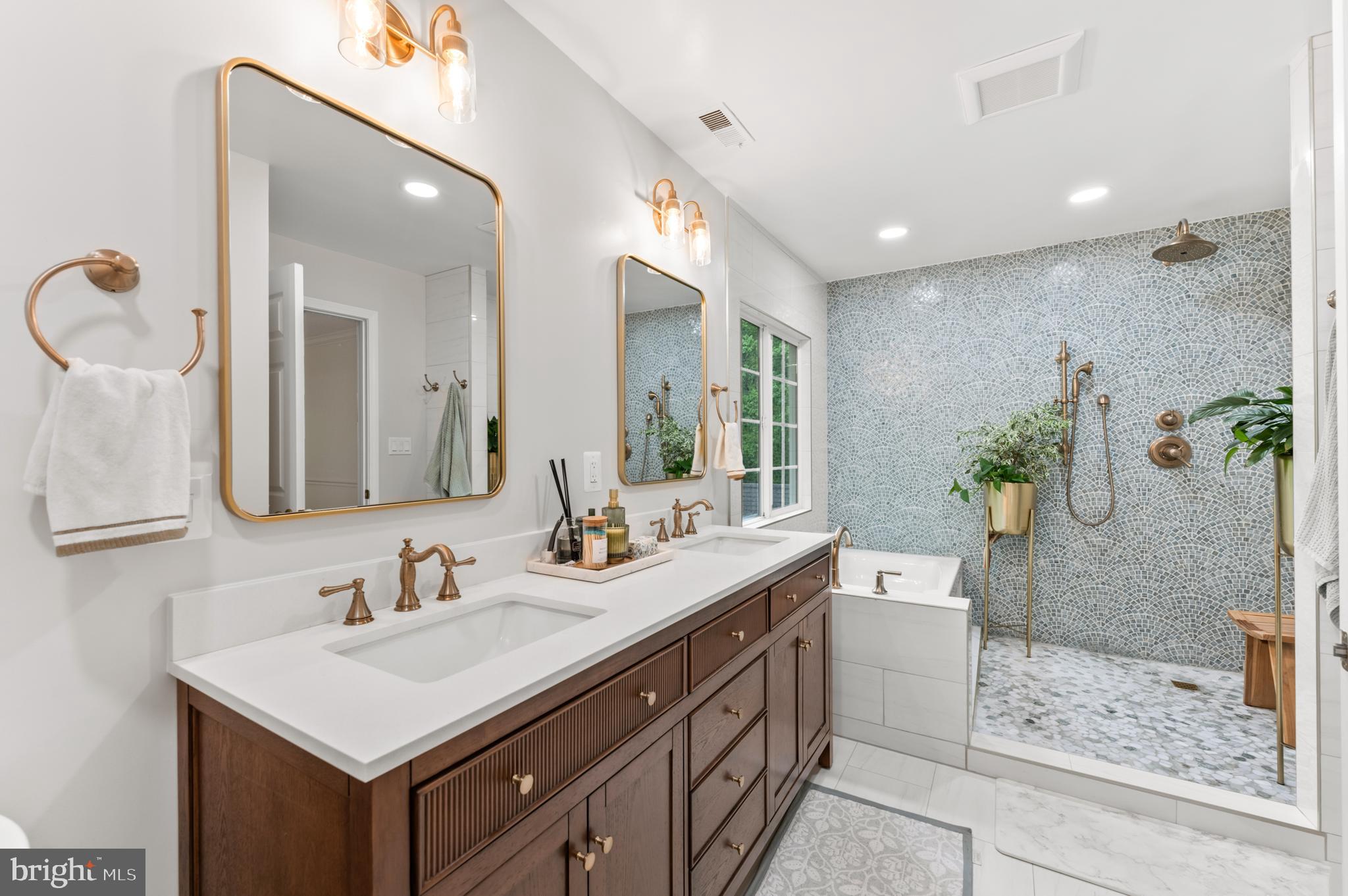 7362 Clifton Road Clifton, VA 20124 - Photo 24 of 53 a bathroom with a sink a mirror and a shower