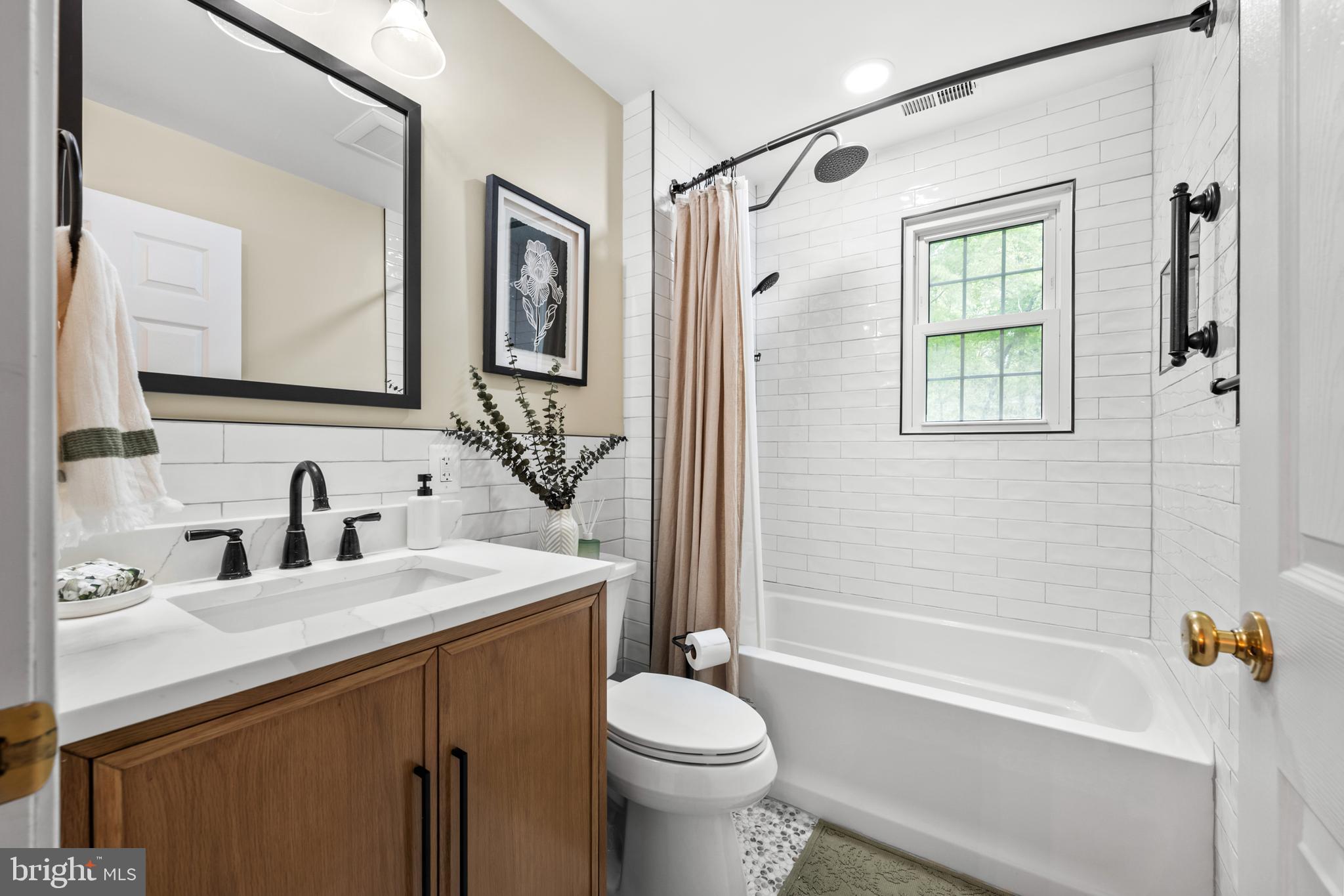 7362 Clifton Road Clifton, VA 20124 - Photo 32 of 53 a bathroom with a sink toilet and shower