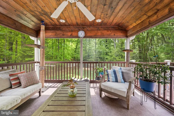 a view of a balcony with wooden floor