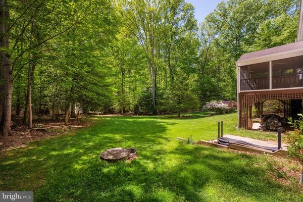 a view of a backyard with swimming pool