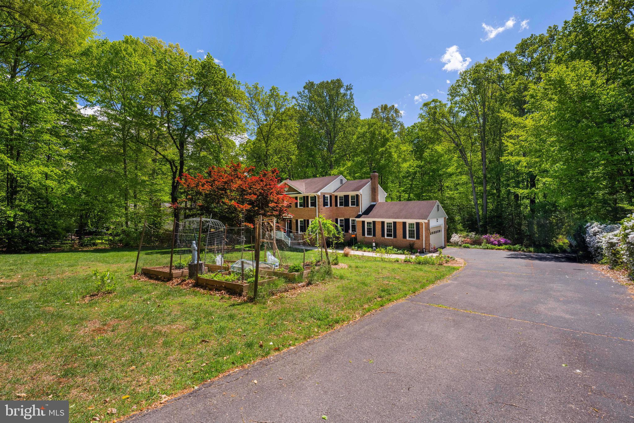7362 Clifton Road Clifton, VA 20124 - Photo 52 of 53 a view of an house with backyard space and garden