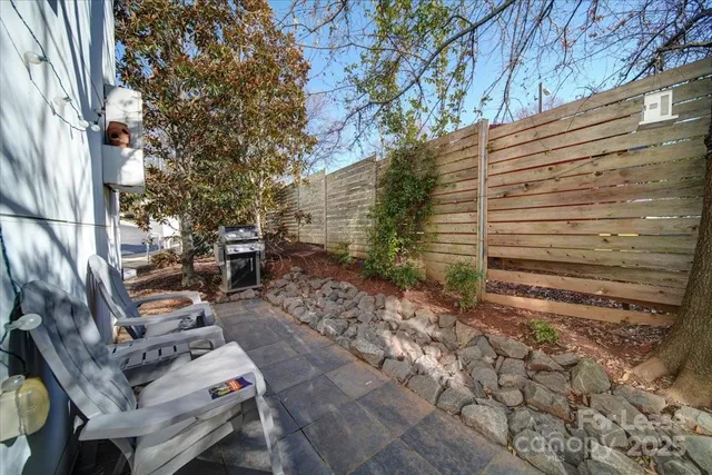 a backyard of a house with outdoor seating