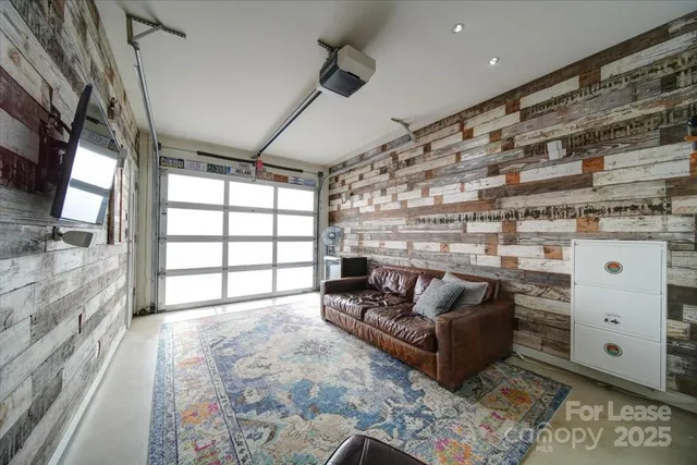 a spacious bedroom with a bed and a couch