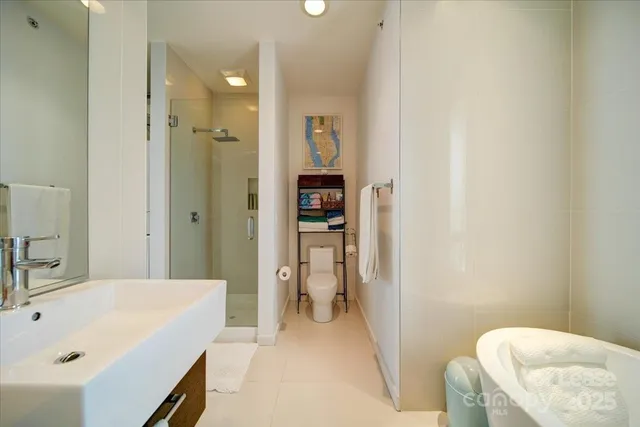 a en suite bathroom with a tub sink and toilet