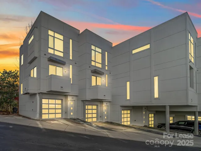 a view of a building with a street