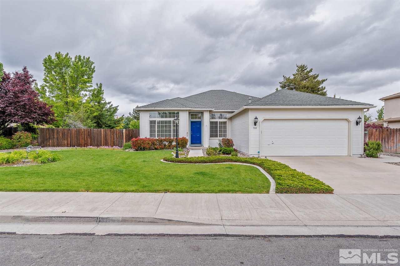 705 Gold Run Court Reno, NV 89521 - Photo 1 of 17 a front view of a house with a yard and a garage