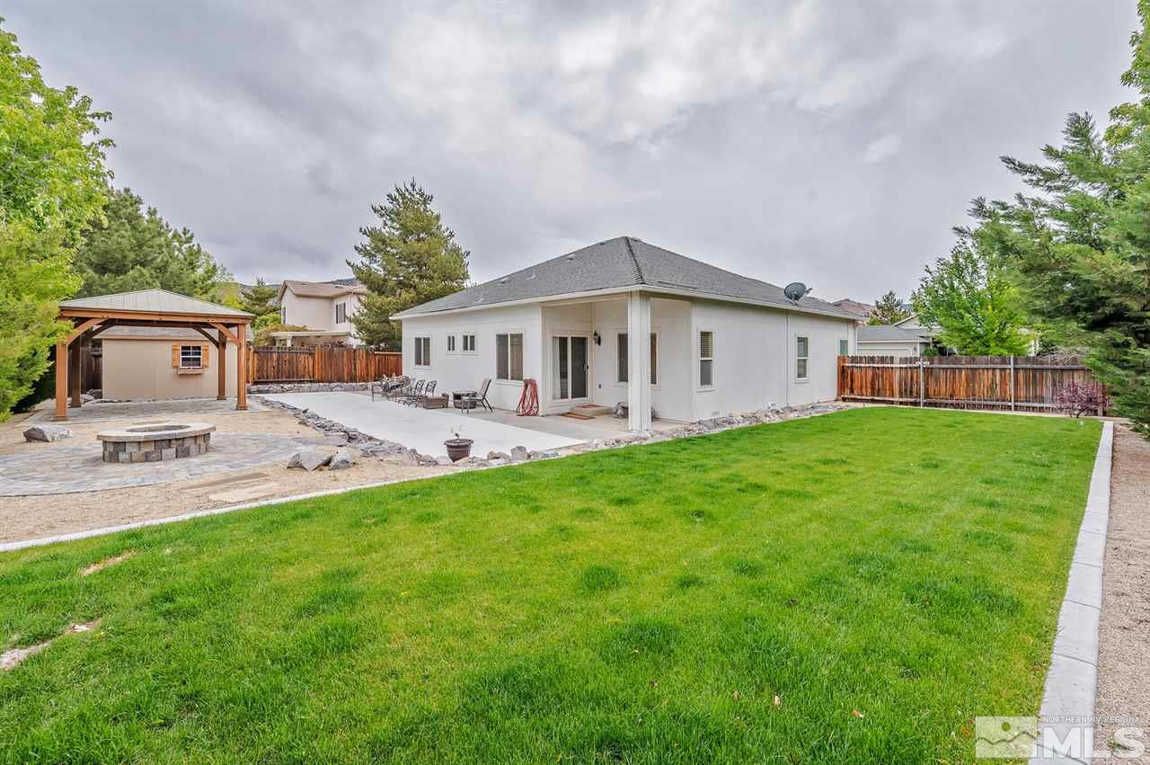 705 Gold Run Court Reno, NV 89521 - Photo 16 of 17 a view of a house with a backyard and a patio
