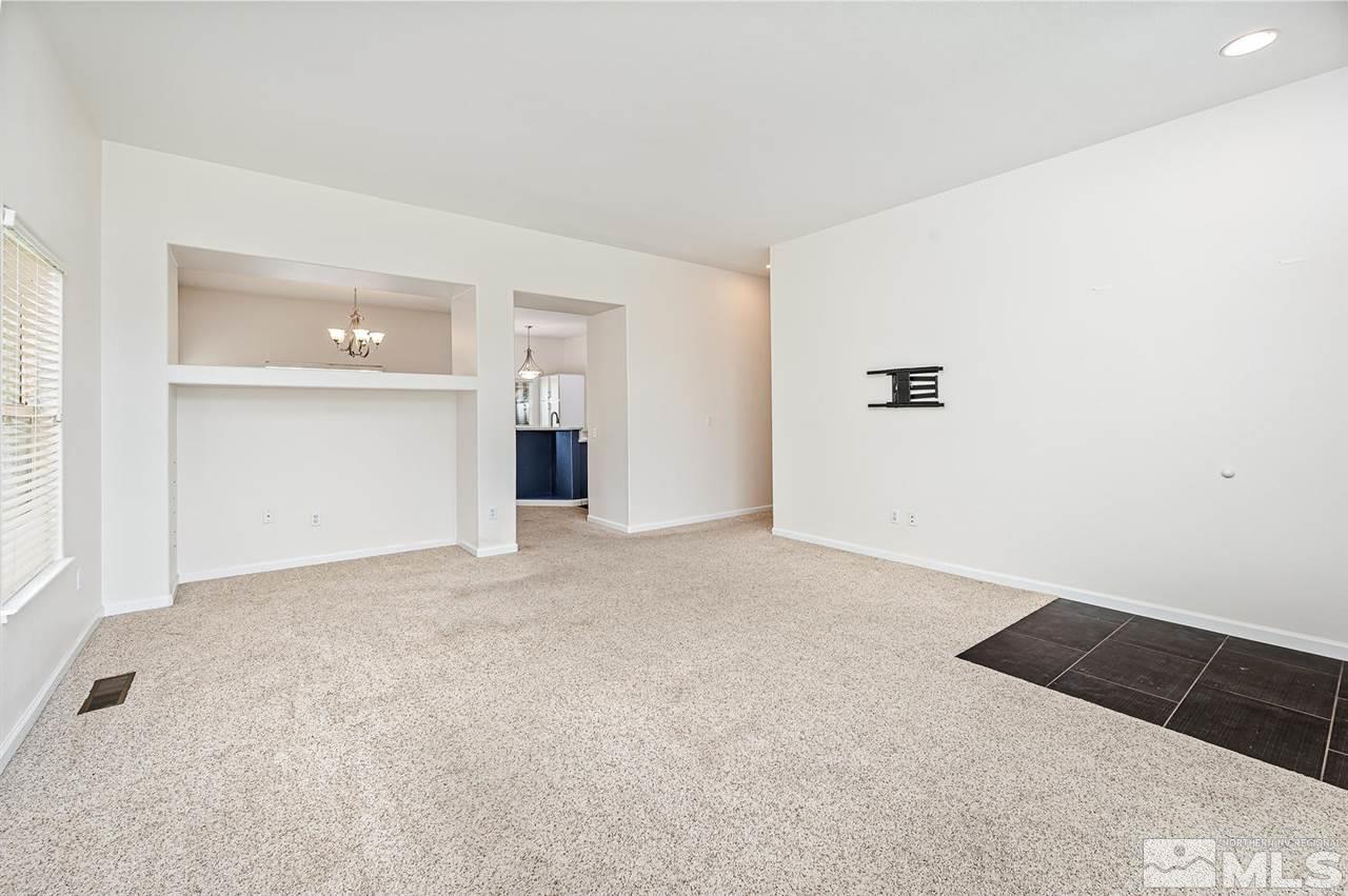 705 Gold Run Court Reno, NV 89521 - Photo 4 of 17 an empty room with a kitchen