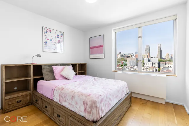 a bedroom with a bed and window