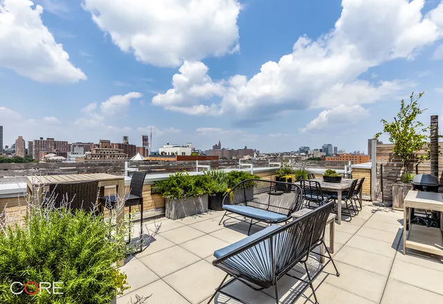 a view of a terrace with sitting area