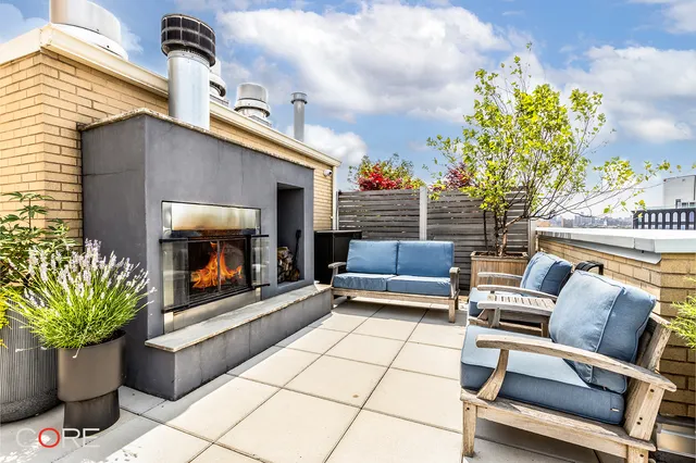 a outdoor living space with furniture and a potted plant