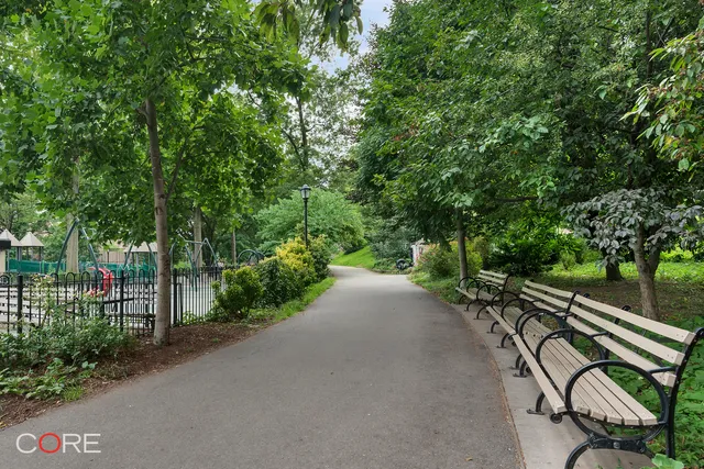 a view of a street with a bench