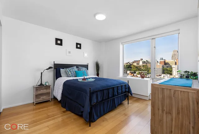 a bedroom with a bed and window