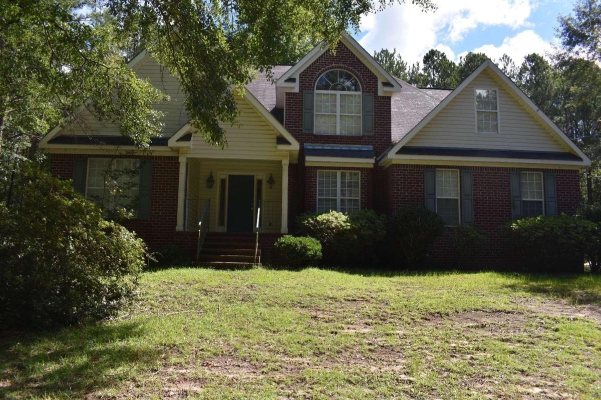 a front view of a house with a yard