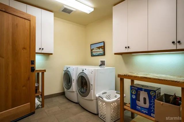 a view of balcony with a table and chairs