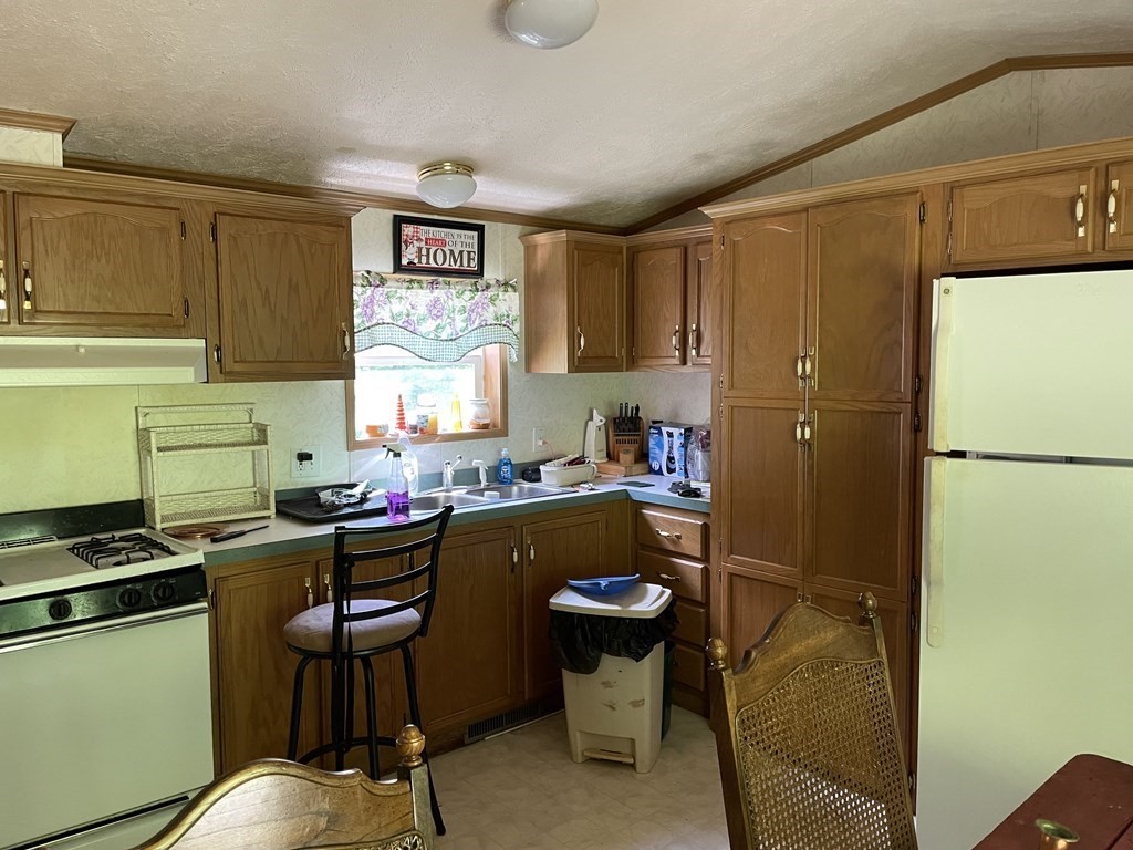 37 South County Road Florida, MA 01247 - Photo 5 of 21 a kitchen with a refrigerator and a stove top oven