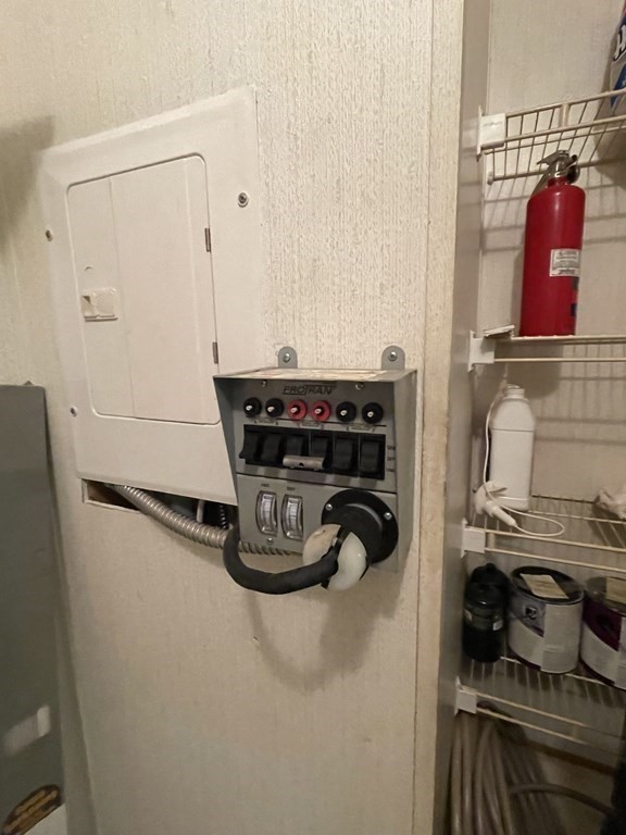 37 South County Road Florida, MA 01247 - Photo 8 of 21 a room with water heater and wooden cabinets
