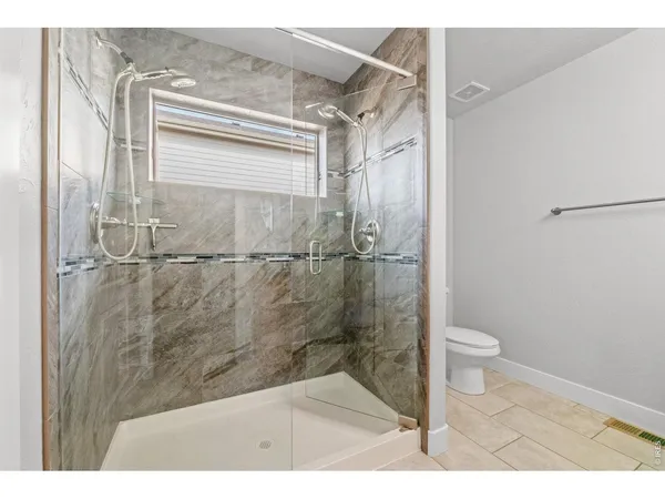 a bathroom with a granite countertop sink a mirror and vanity