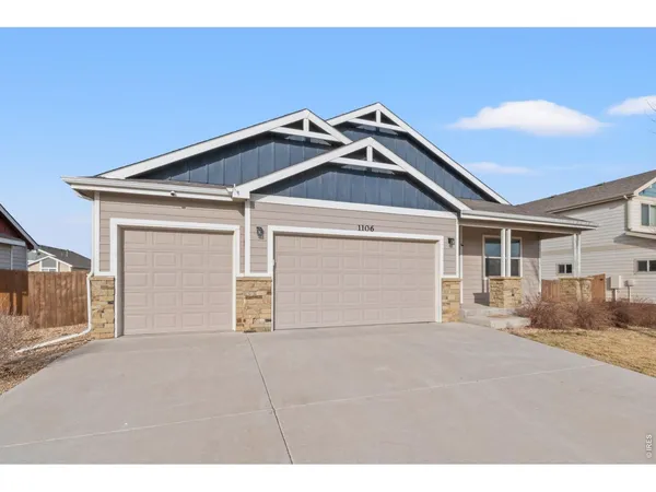 a front view of a house with garage