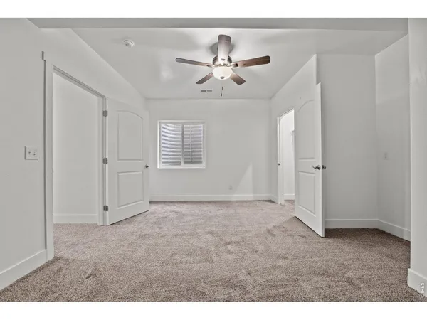 a view of an empty room with a window
