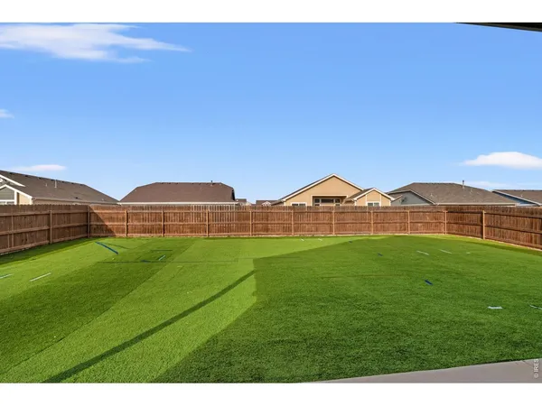 a view of a house with a yard and porch
