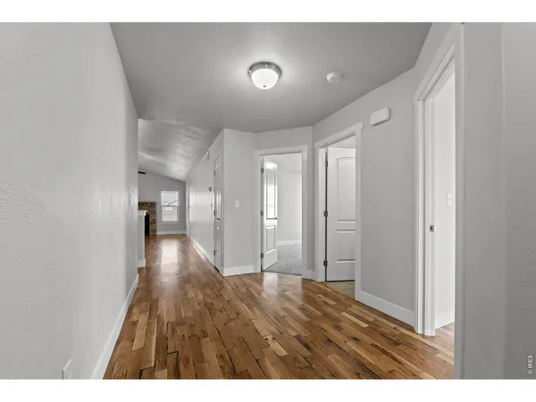 a view of a livingroom with wooden floor
