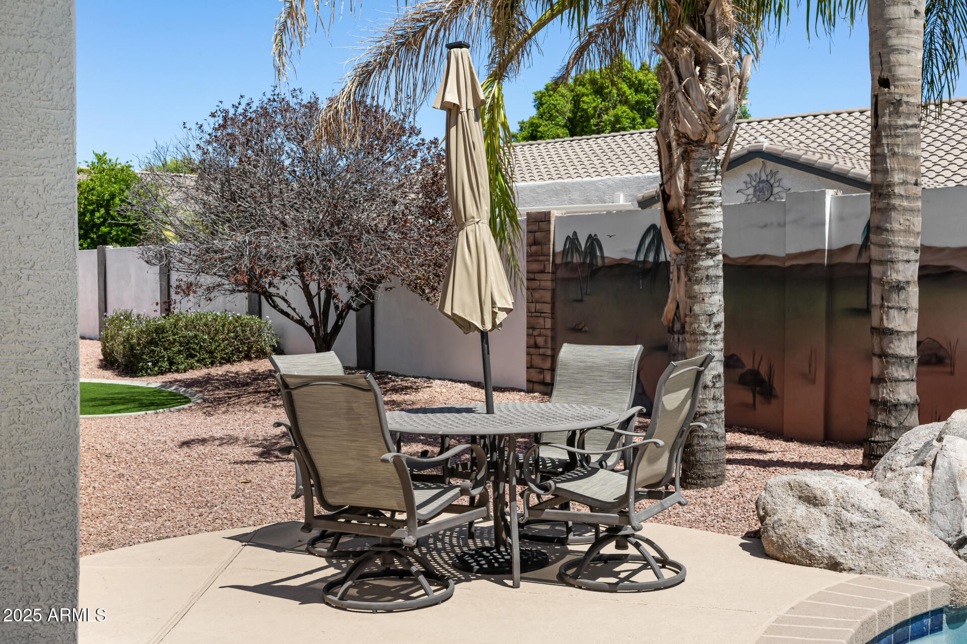 1517 South Arroya Circle Mesa, AZ 85206 - Photo 111 of 111 a view of a patio with table and chairs and potted plants