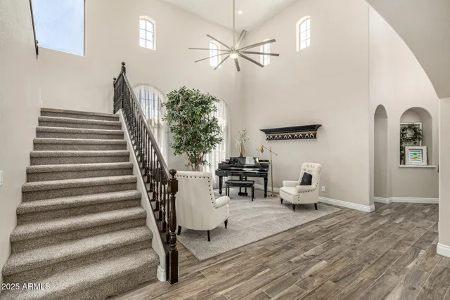 a kitchen with lots of counter top space a sink appliances and living room view