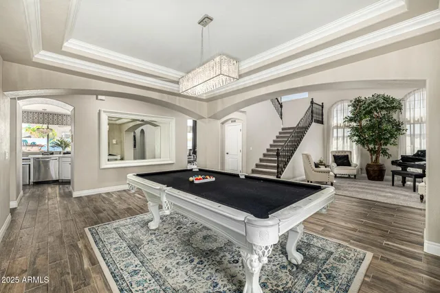 a bedroom with a large bed and a large window