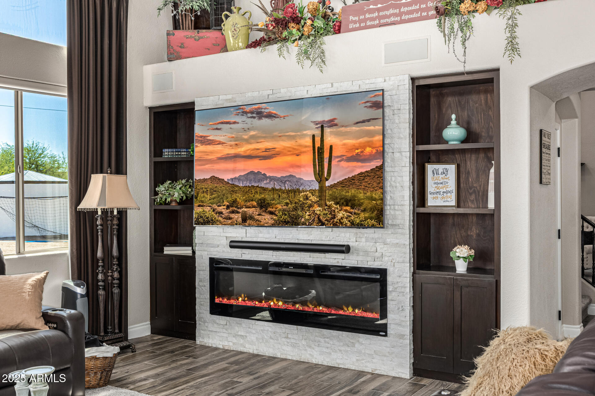 1517 South Arroya Circle Mesa, AZ 85206 - Photo 27 of 111 a living room with furniture and a fireplace
