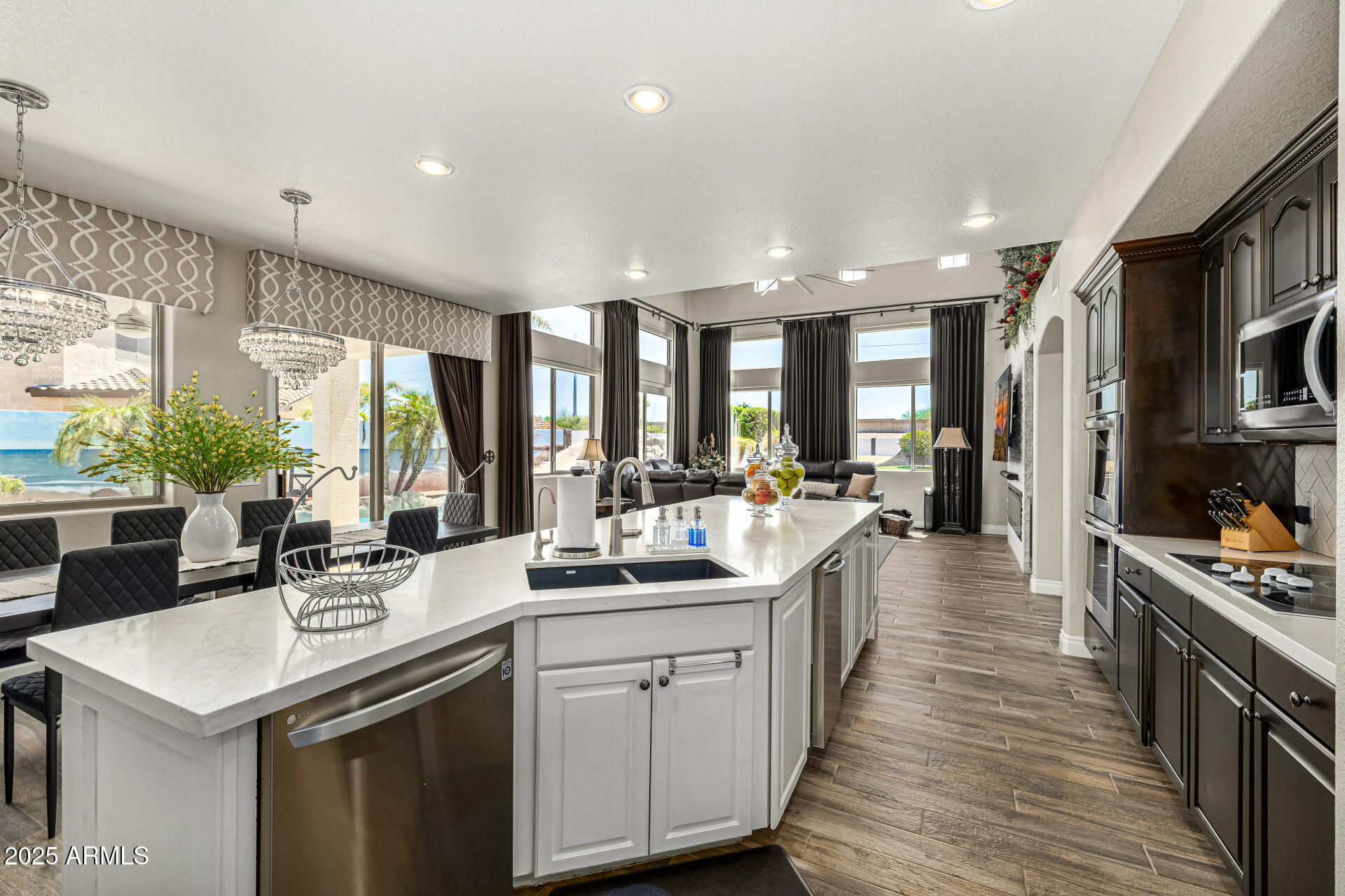 1517 South Arroya Circle Mesa, AZ 85206 - Photo 32 of 111 a kitchen with lots of counter top space a sink appliances and living room view