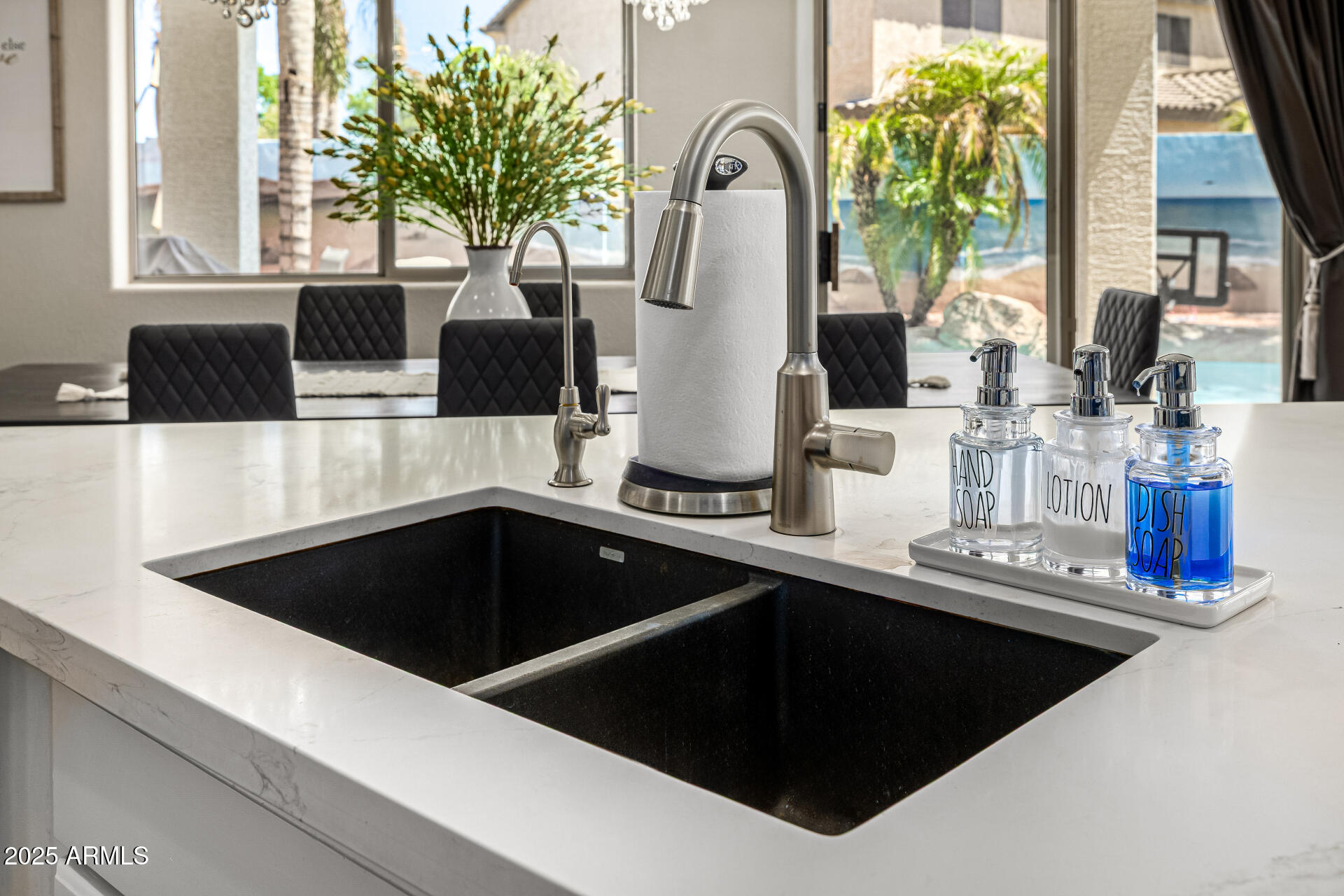 1517 South Arroya Circle Mesa, AZ 85206 - Photo 35 of 111 a kitchen with a sink and a potted plant