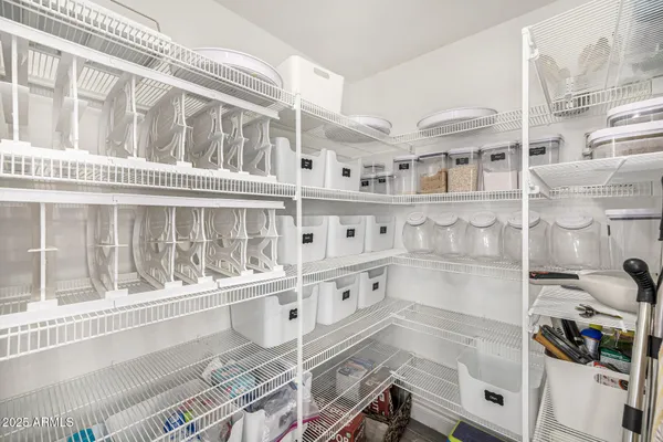 a view of a livingroom with furniture and a ceiling fan