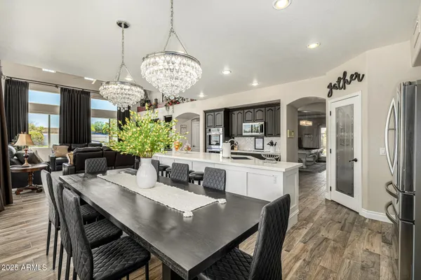a bedroom with furniture and a chandelier