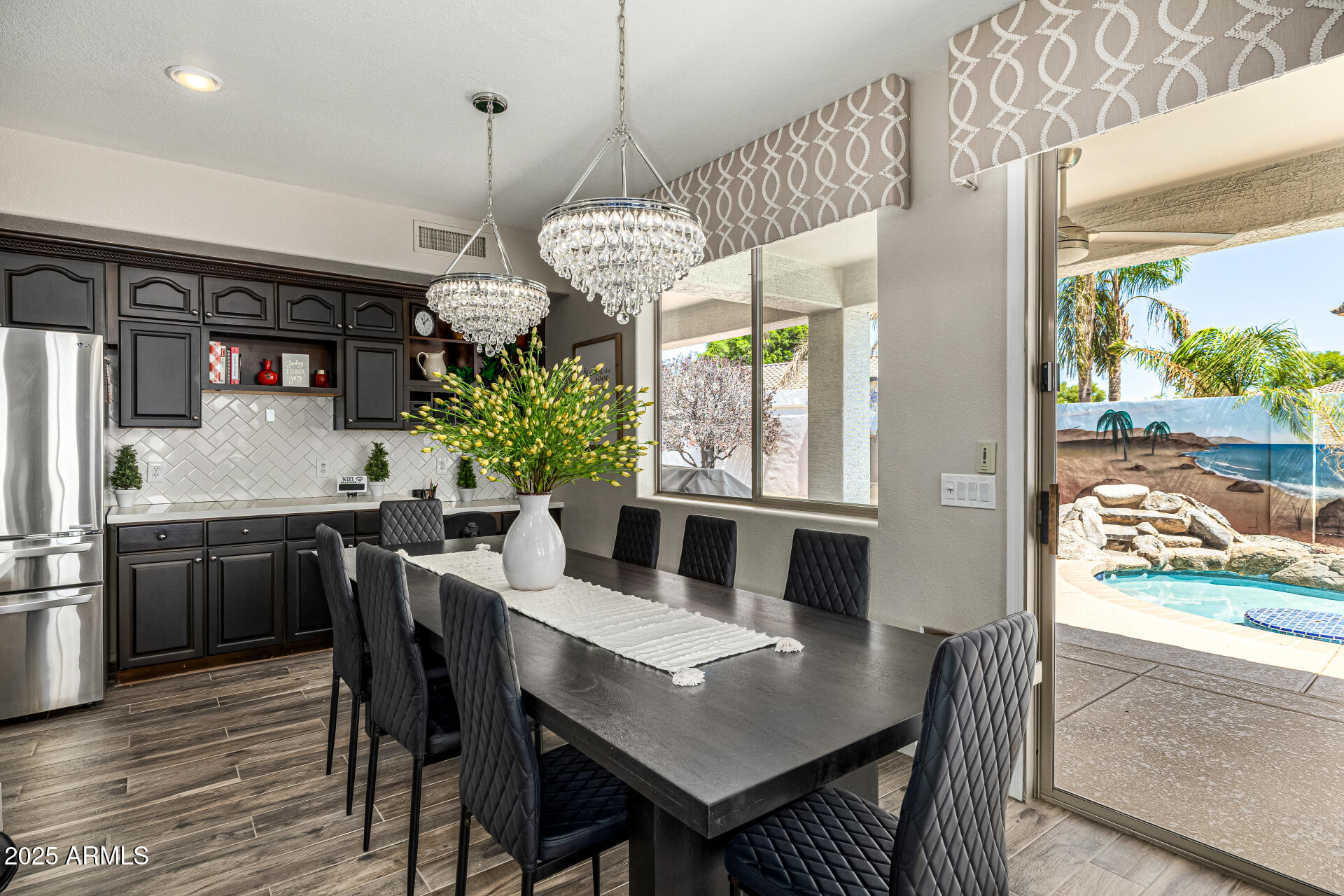 1517 South Arroya Circle Mesa, AZ 85206 - Photo 38 of 111 a view of a dining room with furniture window and wooden floor