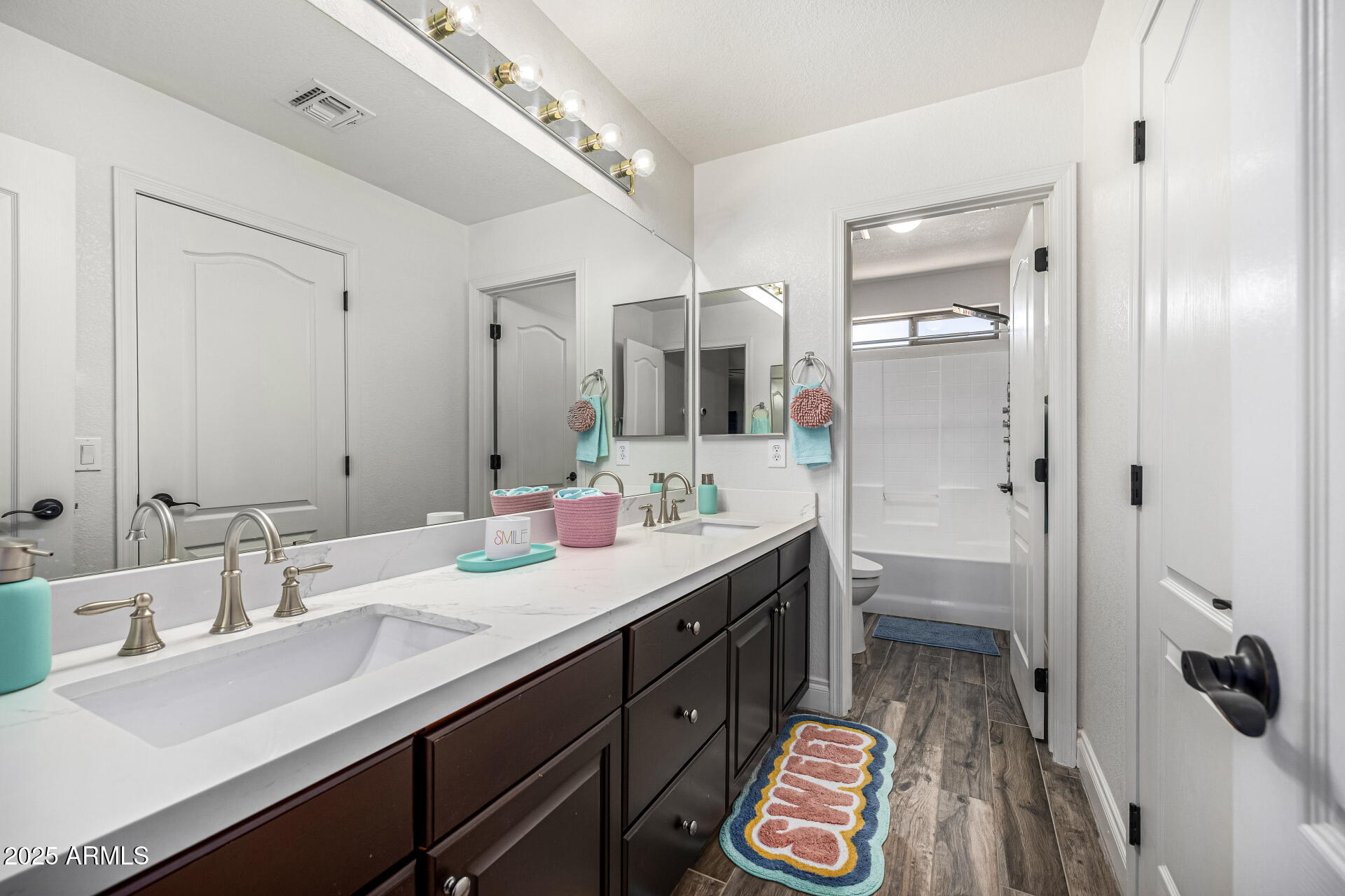 1517 South Arroya Circle Mesa, AZ 85206 - Photo 58 of 111 a spacious bathroom with a double vanity sink mirror and double