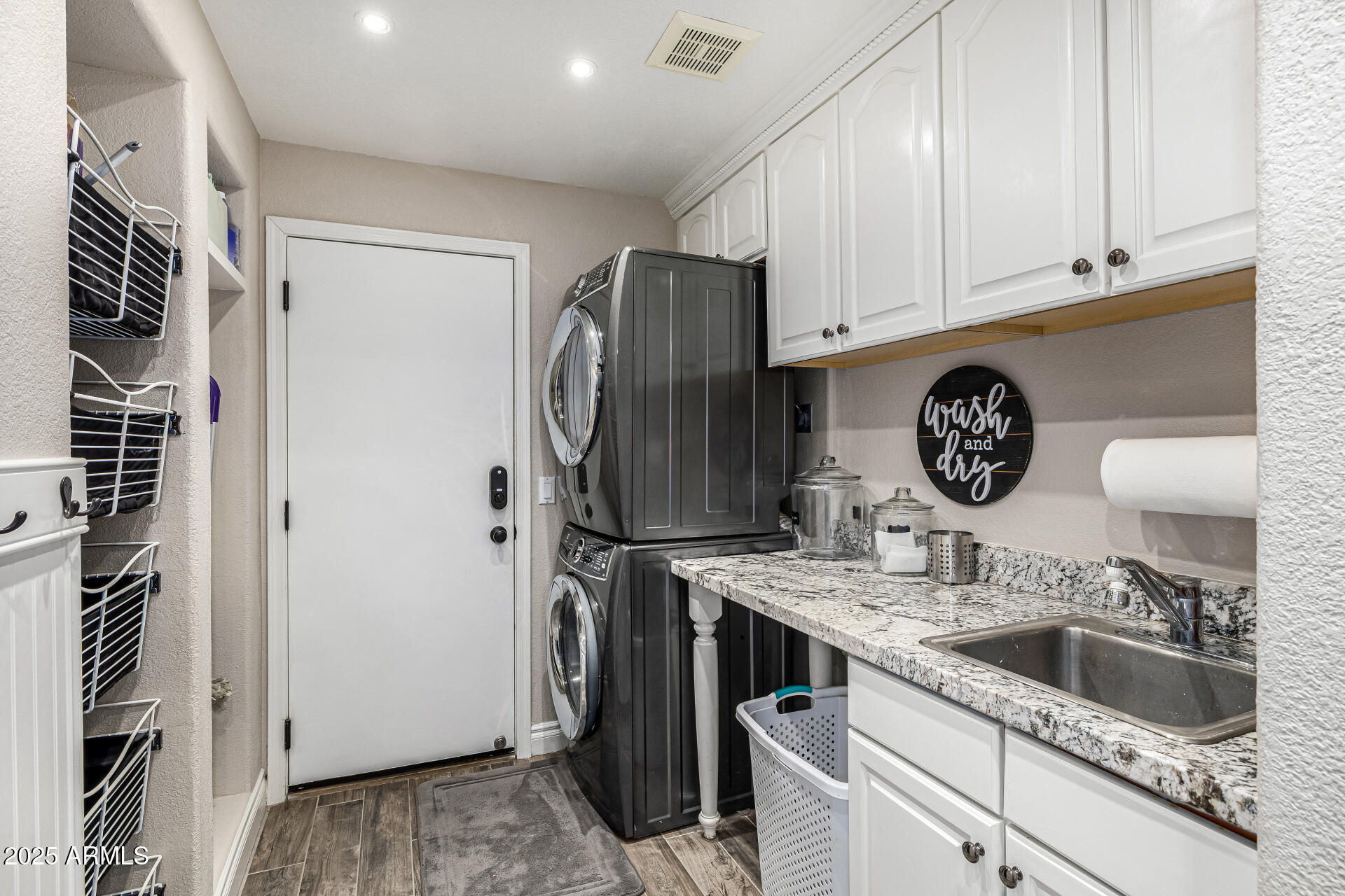 1517 South Arroya Circle Mesa, AZ 85206 - Photo 82 of 111 a kitchen with stainless steel appliances granite countertop a refrigerator and a sink