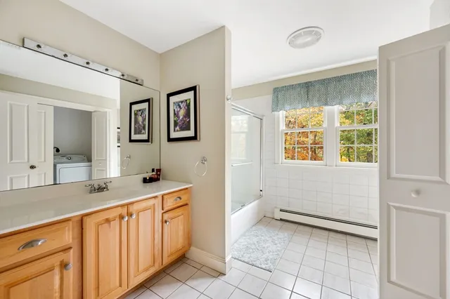 a bathroom with a sink a vanity and a mirror