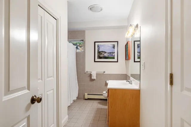 a view of a bathroom with a tub and shower