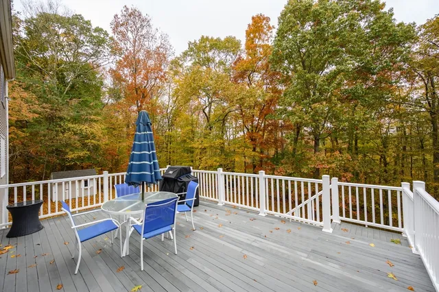 a view of a chair and table on the wooden floor