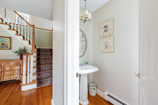 a view of an entryway with wooden floor