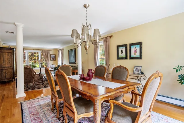 a dining room with furniture and window