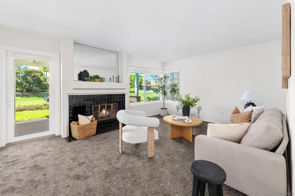 a living room with furniture and a fireplace