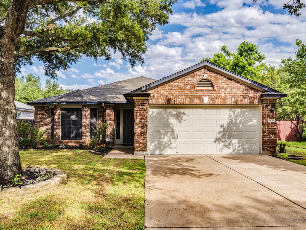 9018 Whiteworth Loop Austin, TX 78749 - Photo 1 of 1 a front view of a house with a yard